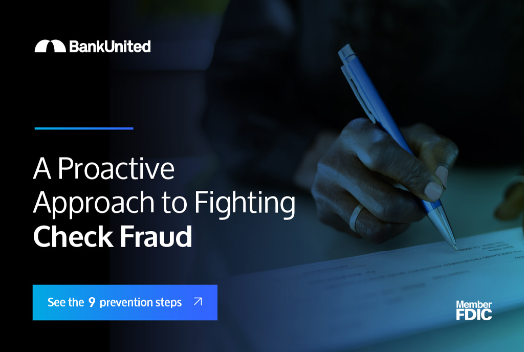 Woman holding pen writing a check