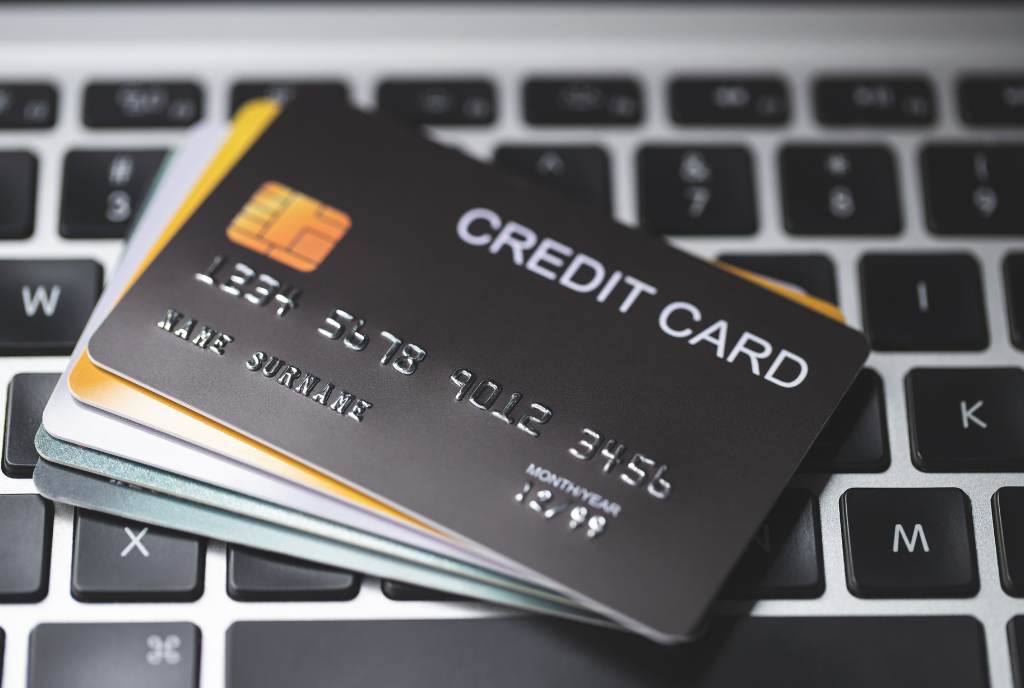 Stack of credit cards on keyboard